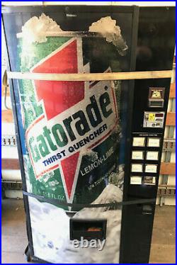 Dixie Narco Cold Drink Soda Vending Machine with Gatorade Graphic. Coins & Bills