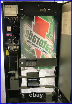 Dixie Narco Cold Drink Soda Vending Machine with Gatorade Graphic. Coins & Bills