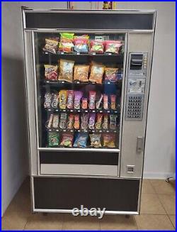 Snack, Candy, Chip coin-operated vending machine. Dollar and coin accepted