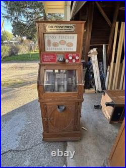 The Penny Press Penny Pincher Souvenir Coin Machine with Wooden Cabinet