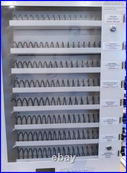 Vending machine to dispense packs of medicine or first aid supplies 1 qtr vend